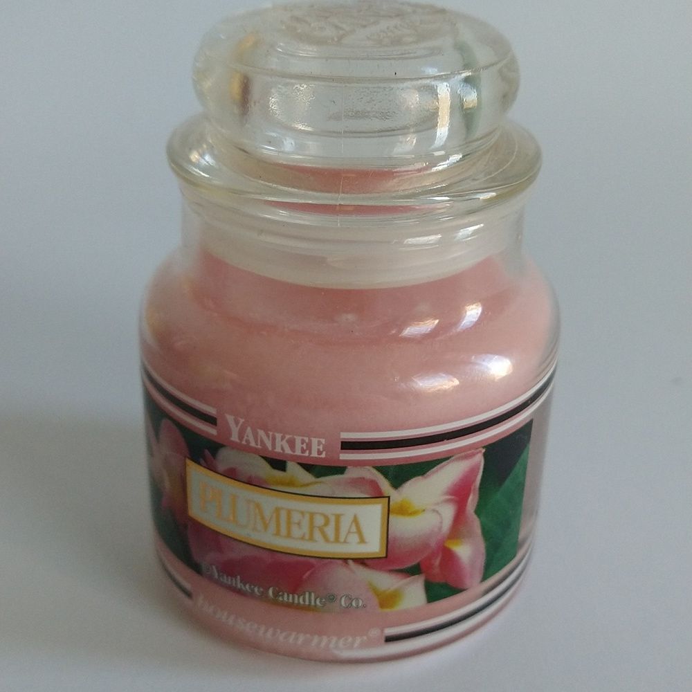 YANKEE CANDLE - black band- retired PLUMERIA- 3.7oz- never used.